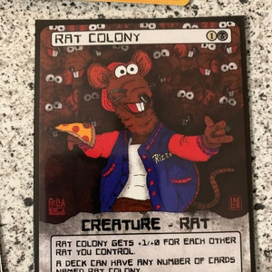 May include: A trading card featuring a cartoon rat character holding pizza. The card is titled "RAT COLONY" and has text describing its game mechanics. The rat wears a blue and red jacket with the name "Rizzo" on it.