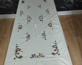 Your choice of hand-embroidered tablecloth or placemats. Crafts from Madagascar 8/12 napkins