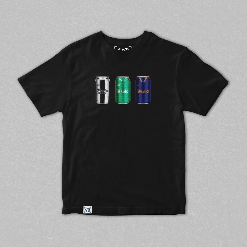 May include: Black t-shirt featuring three stylized beverage can designs. The cans are in the colors of soccer jerseys: black and white stripes, green, and blue with a yellow V-neck design. The word "fasela" is printed on each can.