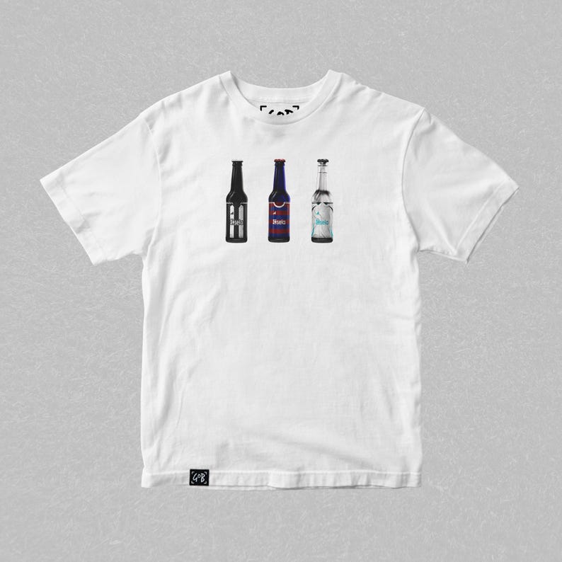 May include: White t-shirt with a graphic of three bottles of beer. The bottles are all different brands and have different labels. The shirt is a standard fit and has a crew neck.