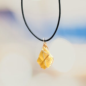 small and minimalist raw honey calcite wire wrapped unique crystal necklace
