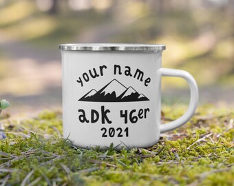 May include: White enamel camping mug with a black mountain silhouette and the text "your name adk 46er 2021".