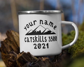 May include: White enamel camping mug with a black mountain silhouette and the text "your name Catskills 3500 2021".