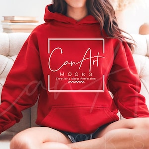 May include: A red hoodie with a white logo that says "CanArt MOCKS Creativity Meets Perfection".