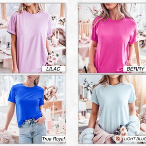 May include: Four different colored t-shirts, lilac, berry, true royal blue, and light blue, are shown on models. Each t-shirt has a crew neck and short sleeves.