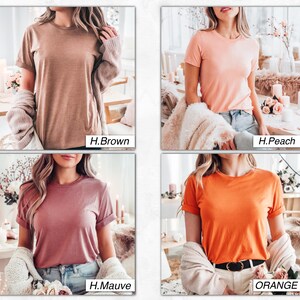 May include: Four different colored t-shirts, each with a crew neck and short sleeves. The colors are brown, peach, mauve, and orange.