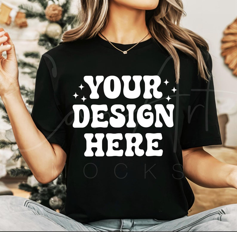 May include: Black t-shirt with the text "YOUR DESIGN HERE" in white retro-style lettering.
