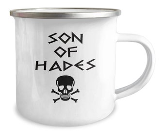 May include: White enamel mug with a black skull and crossbones design and the text "Son of Hades" in a stylized font.