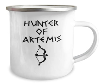 May include: White enamel mug with a silver rim and a black design that says "HUNTER OF ARTEMIS" in a stylized font. A black bow and arrow are below the text.