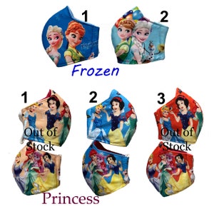 May include: A set of six fabric face masks featuring Disney Princesses and Frozen characters. The masks are blue, red, and white with various princess characters. The masks are labeled with numbers 1, 2, and 3. Some masks are labeled "Out of Stock".