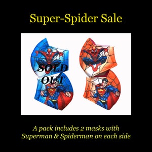 May include: Two face masks with a Spiderman and Superman design. The masks are blue, red, and orange with a spider web pattern. The text "SOLD OUT" is printed on the masks.