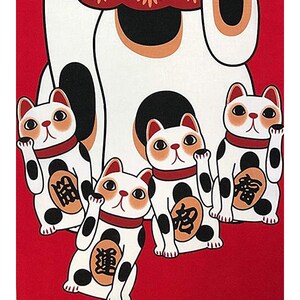 May include: Four white lucky cat figurines with black spots and red collars on a red background. The larger cat has its right paw raised, while the three smaller cats have their left paws raised. Each cat has a gold coin on its chest with Japanese characters.