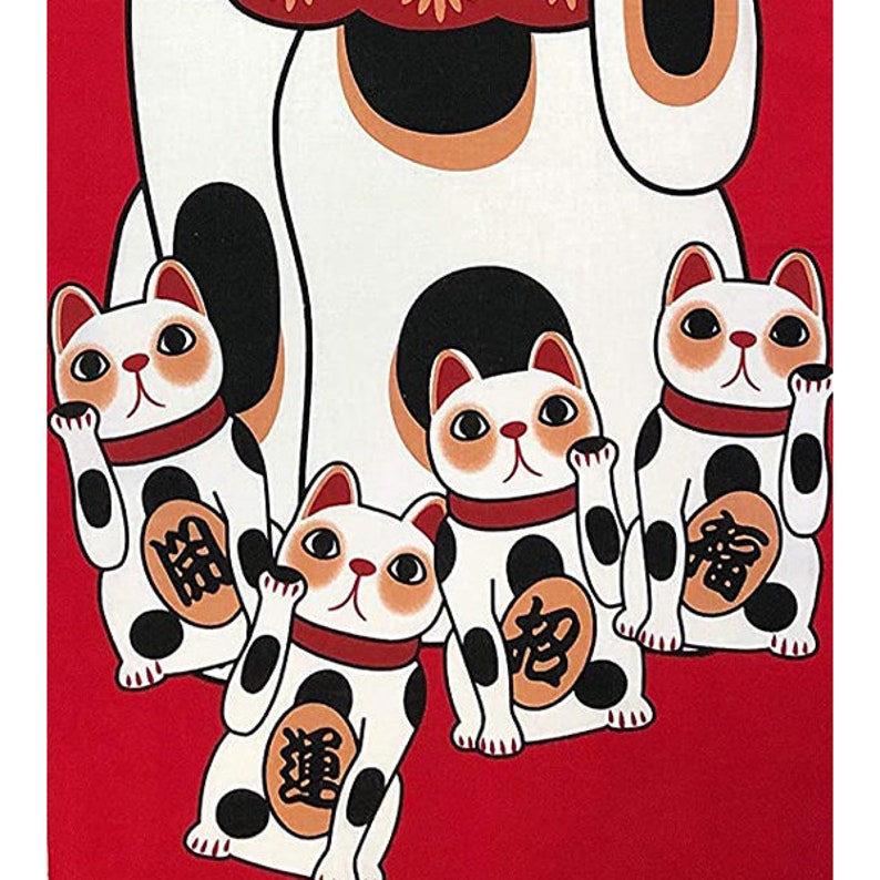 May include: Four white lucky cat figurines with black spots and red collars on a red background. The larger cat has its right paw raised, while the three smaller cats have their left paws raised. Each cat has a gold coin on its chest with Japanese characters.