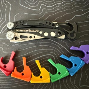 Leatherman Skeletool Thumb Stud e testa d'impatto
