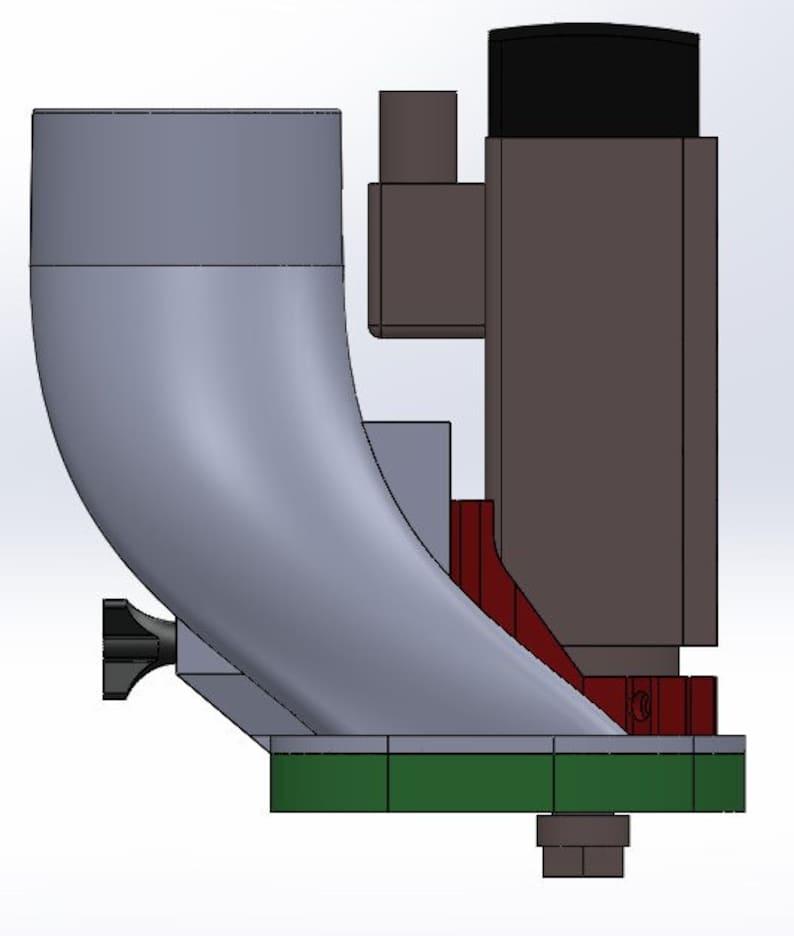 May include: A 3D model of a gray and black industrial machine with a green base and a red component. The machine has a curved, funnel-shaped part and a small black knob.