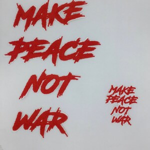 May include: Red embroidered patches with the text "Make Peace Not War" in a bold, stylized font. The patches are on a white background.