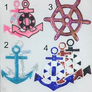 May include: Four iron-on patches with nautical themes.  The patches are made of sequins and feature an anchor, a steering wheel, and a life preserver.  The numbers 1, 2, 3, and 4 are printed on the white background.