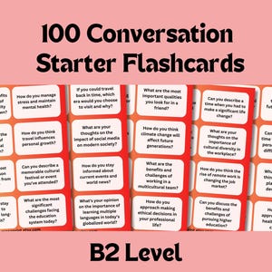 Puede incluir: Un conjunto de 100 tarjetas de inicio de conversación diseñadas para estudiantes de inglés de nivel B2. Las tarjetas son rojas con texto blanco y presentan una variedad de temas de conversación.