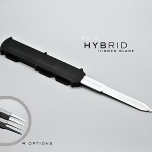 Op de afbeelding: Een zwart en zilveren zakmes met een verborgen mes. Het mes is gelabeld "V2.0 HYBRID HIDDEN BLADE".