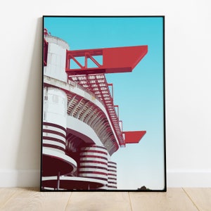 Könnte beinhalten: Ein rot-weißes Stadion mit blauem Himmel im Hintergrund. Das Stadion hat ein einzigartiges Design mit einem geschwungenen Dach und einer Reihe von Rängen.