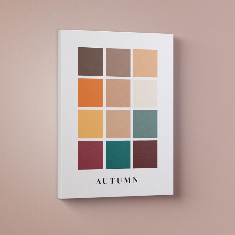 May include: A white canvas print with a color palette of 12 squares in shades of brown, orange, yellow, teal, and burgundy. The word "AUTUMN" is printed in black at the bottom of the print.