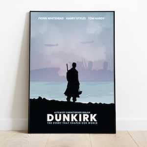 May include: A minimalist movie poster for the film "Dunkirk" directed by Christopher Nolan. The poster features a silhouette of a soldier standing on a beach with a blurry background of a cityscape and ships. The text "A film by Christopher Nolan" and "Dunkirk" are displayed in white on a black background. The tagline "The event that shaped our world" is also displayed in white on a black background.