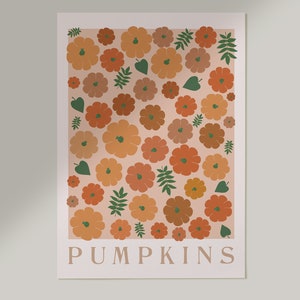 May include: A digital print featuring a pattern of orange, brown, and green pumpkins and leaves on a light pink background. The text "PUMPKINS" is at the bottom of the print.