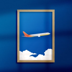 May include: A framed illustration of a white airplane flying in a blue sky with white clouds. The airplane has red and yellow accents.