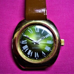 Ruhla Calibre 24 Antimagnetic Wristwatch  Unisex Light Green Metallic Dial White Roman Numerals Large Round TV Style Case Made in GDR