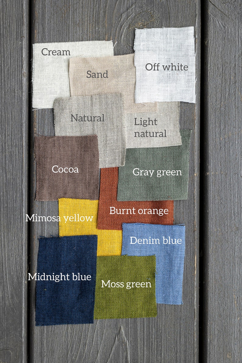 May include: A collection of fabric swatches in various colors, including cream, off white, sand, natural, light natural, cocoa, gray green, burnt orange, mimosa yellow, denim blue, midnight blue, and moss green.