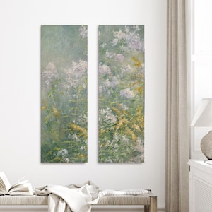 May include: A pair of abstract landscape paintings with a soft, muted color palette. The paintings feature a hazy, atmospheric background with delicate brushstrokes. The foreground is filled with a variety of flowers and foliage in shades of green, white, and yellow.