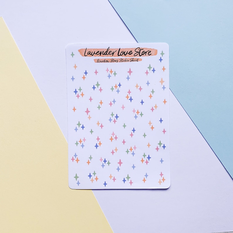 May include: A sheet of rainbow star stickers with the text "Lavender Love Store" and "Rainbow Stars Sticker Sheet".