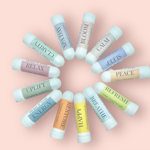 May include: A set of 12 aromatherapy inhalers with various scents and labels, including "Relax", "Uplift", "Energy", "Restore", "Happy", "Breathe", "Refresh", "Peace", "Sleep", "Calm", "Bloom", and "Spa Day".