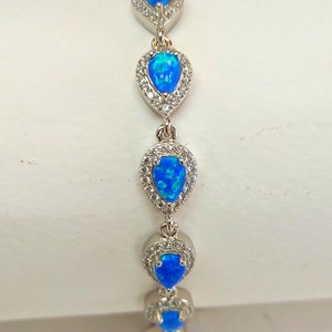 Silver bracelet, with blue opal stones and CZ