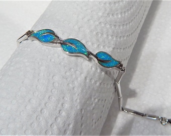 Sterling silver bracelet, blue-green opal stones.