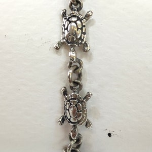 Silver bracelet, hand made, with turtles design