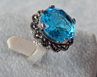 Silver ring with blue topaz stone