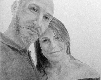 May include: A pencil sketch portrait of a couple, rendered in grayscale. The man, with a shaved head and beard, leans towards the woman. She has long hair and is wearing an off-the-shoulder top. The artwork is detailed and realistic.