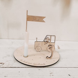 Candle plate tractor including pennant, number and candle