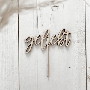 Cake topper “loved”