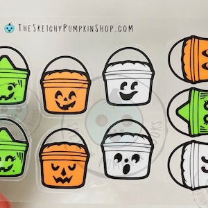 May include: Nine Halloween-themed stickers featuring various buckets with different facial expressions. The buckets are orange, green, and white. The stickers are on a clear sheet.