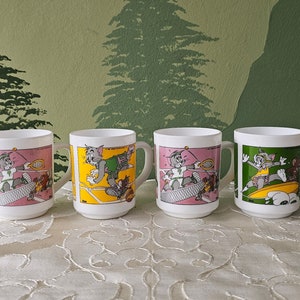 Vintage Arcopal Tom & Jerry coffee mug, 1989 opaline France milk glass tea cup, 80's cartoon comic, Dixan collectible pink yellow green.