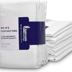 May include: Set of six white flour sack towels, 28 inches by 29 inches, made of 100% cotton. The towels are folded and stacked, with a blue and white label that reads "Linteum Textile Supply, Quality Linens you deserve, Set of 6 Flour Sack Towel, Ultra Absorbent Superior Quality, 100% Cotton, 28" x 29"".