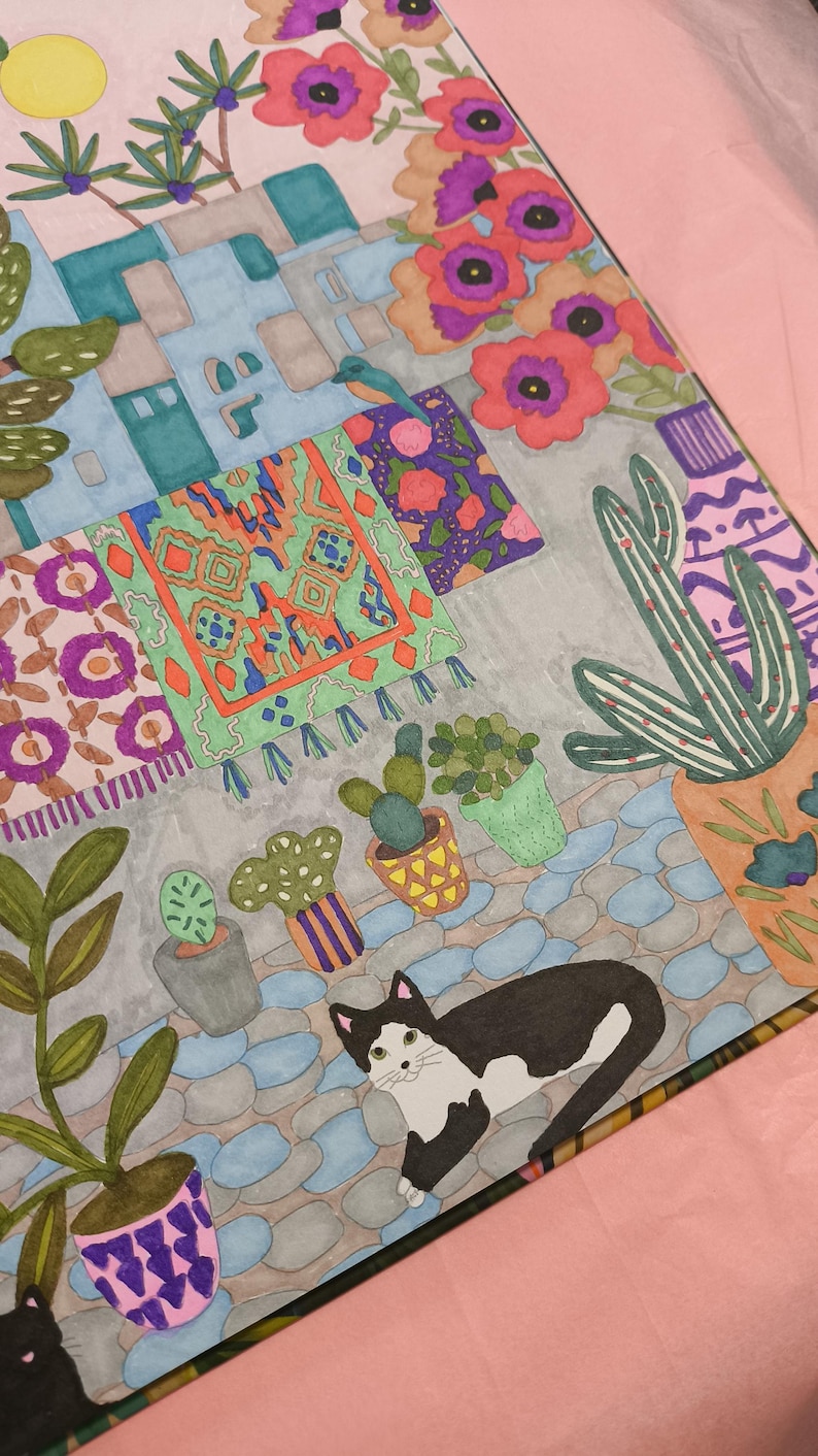 May include: A colorful illustration of a scene with a black and white cat, potted plants, and patterned rugs. The artwork features a variety of flowers, cacti, and a blue cobblestone path. The color palette includes shades of pink, blue, green, orange, and purple.