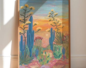 May include: A framed painting of a desert landscape featuring tall blue cacti and yellow flowering stalks against a sunset sky with orange, pink, and blue hues. The foreground includes various green cacti and pinkish ground textures with the signature ELBAKER.