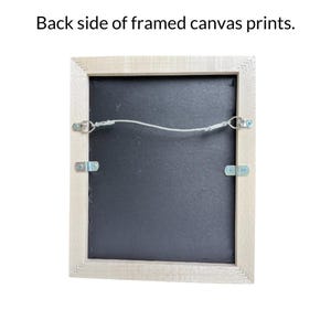 the back side of a framed canvas print, with the frame and the canvas visible.