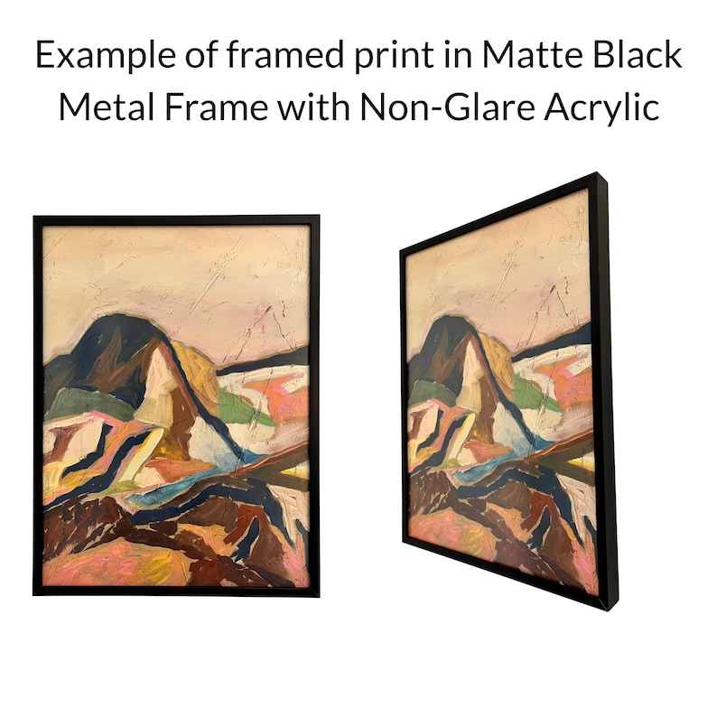 The image is an example of a framed print in a matte black metal frame with a non-glare acrylic finish. The print depicts a landscape scene with mountains and hills in various colors and textures.