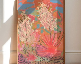 May include: A rectangular framed art print featuring a vibrant, abstract botanical painting. The composition displays tall, pale pink yucca-like flower stalks against a warm background of orange, coral, and blue hues with dark textured ground.