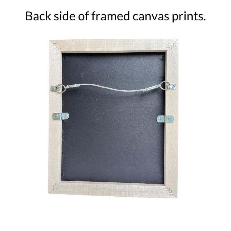 the back side of a framed canvas print, with the frame and the canvas visible.