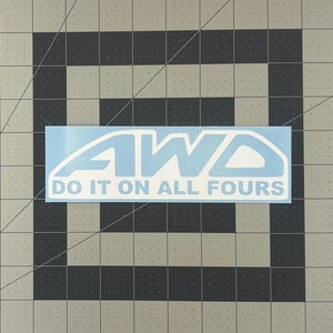 May include: A blue and white sticker with the text "AWD DO IT ON ALL FOURS".